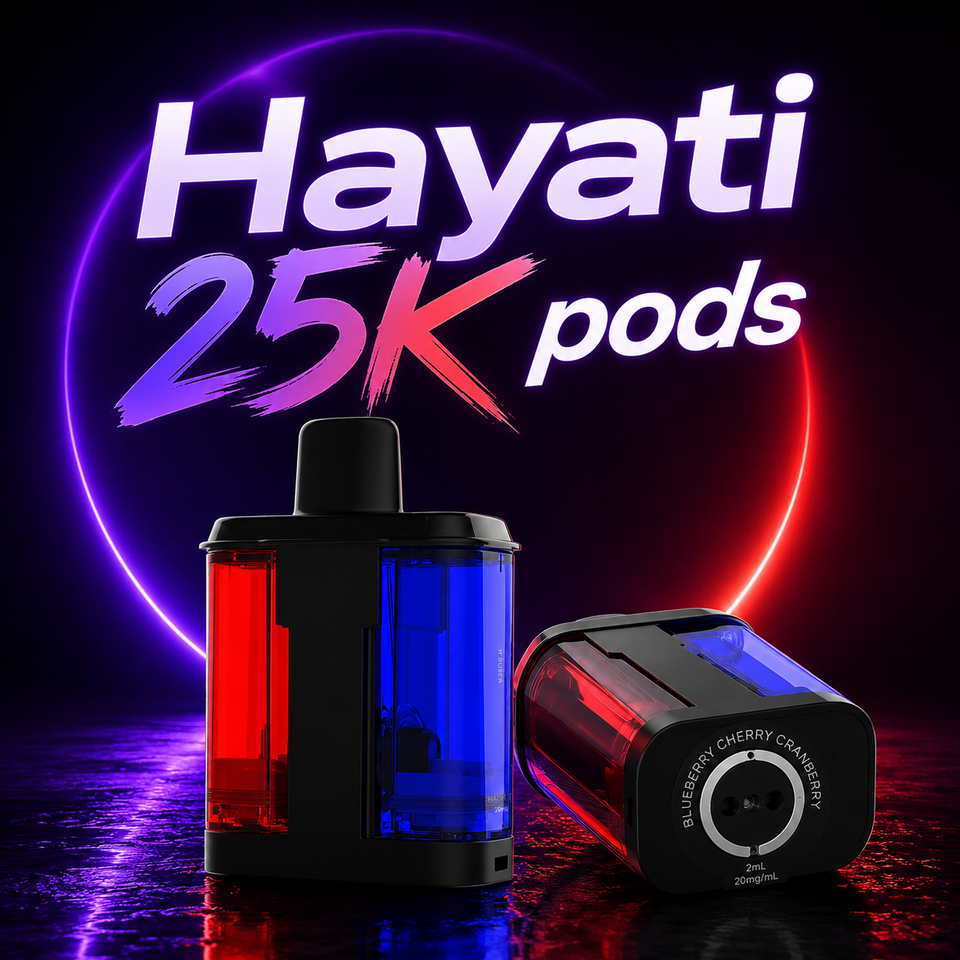 Two Hayati 25K pod disposable vape devices shown on a dark reflective studio surface with a glowing neon-style background. One device stands upright and the other lies on its side, both featuring translucent red and blue chambers with black bodies.